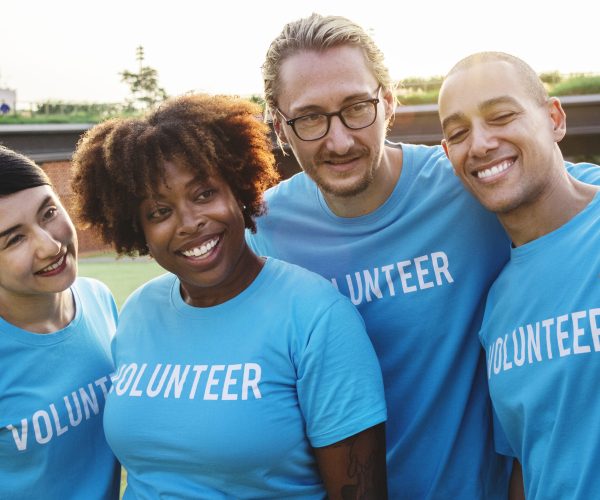 Group of happy and diverse volunteers